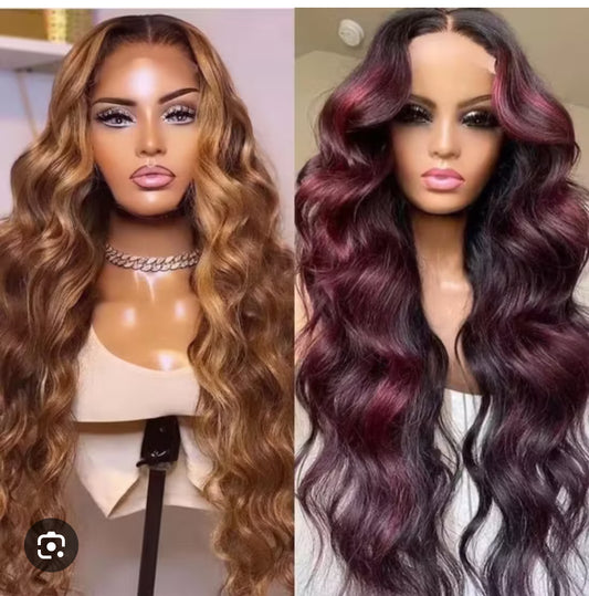 Two mannequin heads with wigs, one brown and one purple, on a plain background.